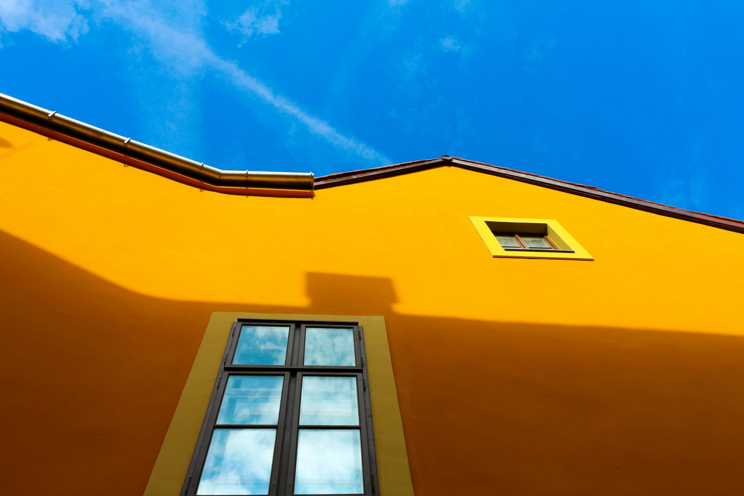 Exterior house façade painted in bright orange