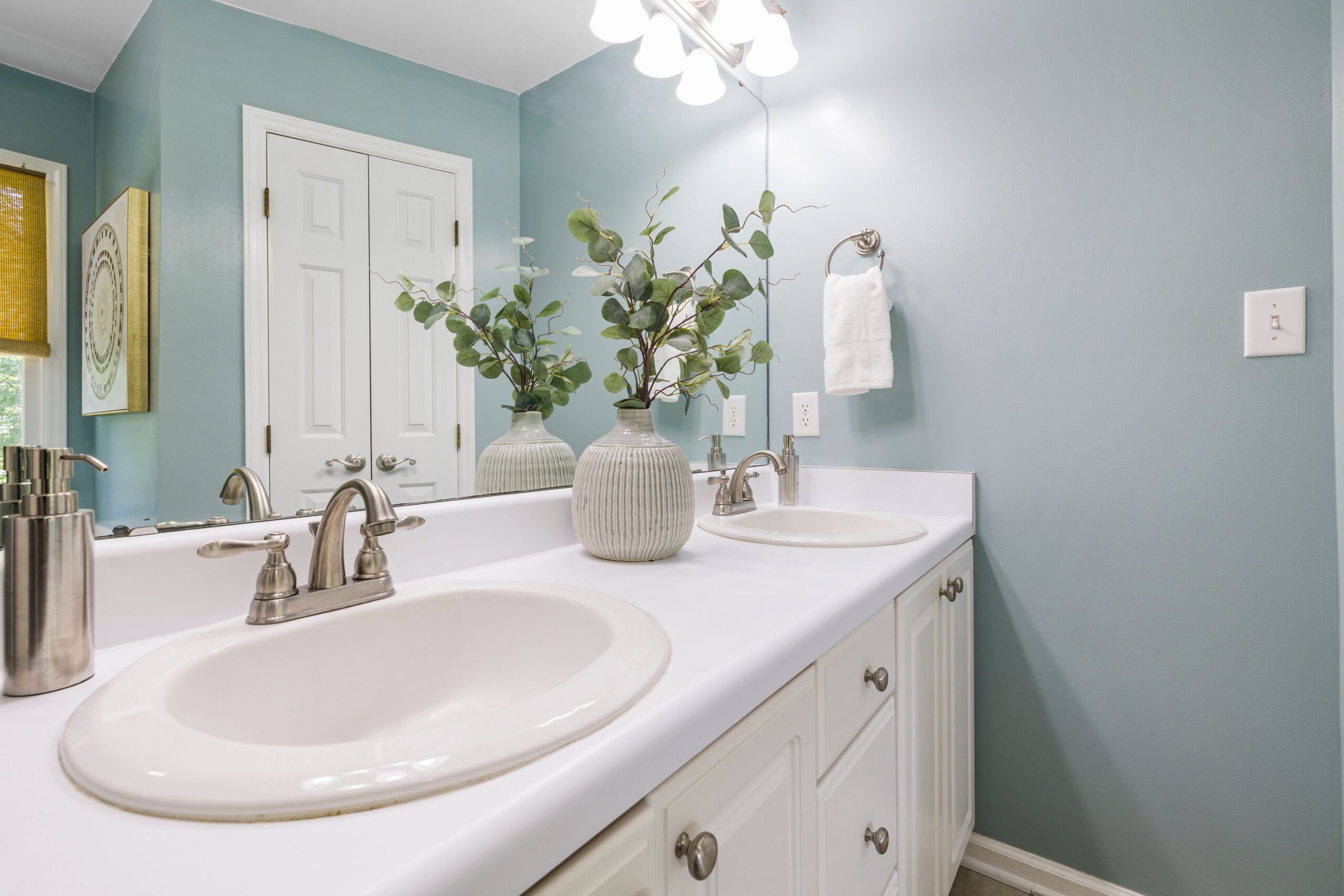 Bathroom walls painted in pale blue
